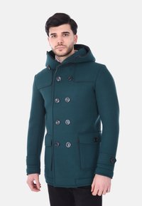 Cappotto peacoat verde in mélange di lana con cappuccio, design doppiopetto, dettagli con bottoni neri e tasche laterali. Vestibilità sagomata con linee strutturate.