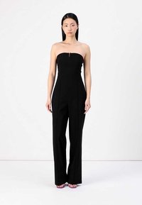 Svart strapless jumpsuit med fitted liv og vide ben, med en subtil glidelåsdetalj foran, laget av glatt stoff.