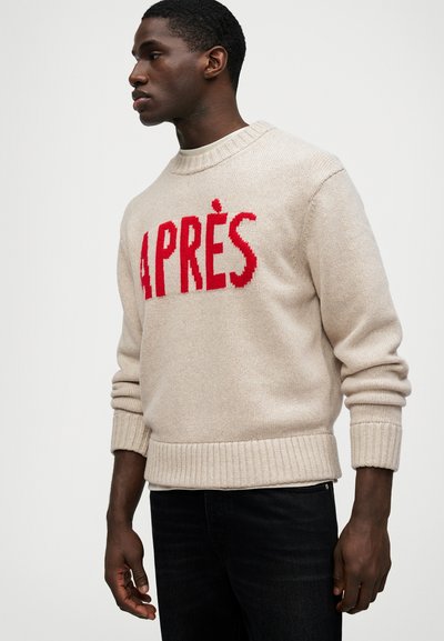 Bežinis megztinis su briaunuotomis rankovėmis ir apačia. Priekis puošia ryškiai raudonas užrašas "APRÈS". Lygi tekstūra, apvalus kaklas.