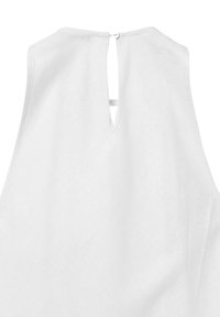 Top bianco senza maniche con dettaglio a oblò sul retro e chiusura con bottoni, realizzato in tessuto liscio con un design pulito e minimalista.