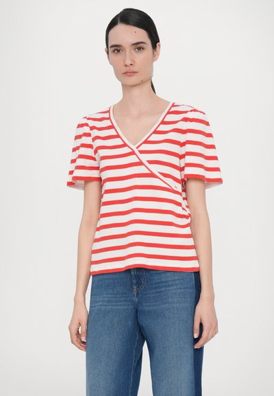 Red and white striped top with short sleeves and a deep V-neck. Made of ribbed fabric with an asymmetrical front design.