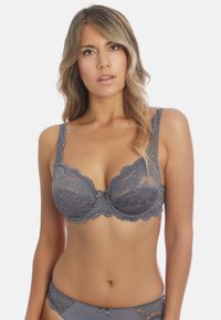 Gray lace bra featuring a floral pattern, scalloped edges, and a small center bow. Adjustable straps and sheer cups enhance design detail.
