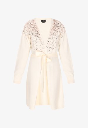 Světle krémový cardigan s véčkovým výstřihem, se zdobením z flitrů podél výstřihu a zavazovacím páskem v pase. Texturovaná pletenina, dlouhé rukávy.