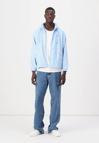 Lacoste Ľahká bunda - light bleu