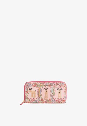 Cartera rosa con cremallera con patrones florales y tres imágenes de perros en dibujos animados que muestran las vistas lateral, trasera y frontal del perro.