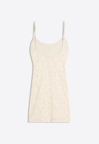Robe nuisette en dentelle couleur crème avec fines bretelles et motifs floraux, présentée à plat sur fond blanc.