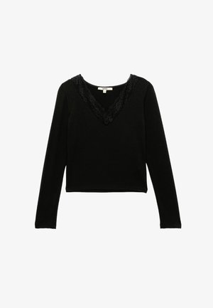 Mustat pitkät hihat -paita, jossa on syvä V-aukko, jota kehystää hieno pitsi. Paita on pehmeä ja sileä tekstuuriltaan, ja siinä on lyhennetty helma.