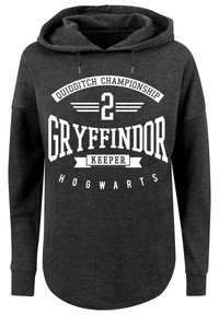 Mørk grå hettegenser med grafikk på forsiden: "Quidditch-mesterskap 2 Gryffindor Keeper Hogwarts," med hvit tekst og detaljer.