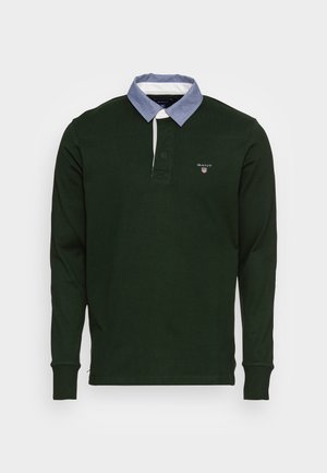 Dark green long-sleeve polo shirt with a light blue buttoned collar and small GANT logo on the left chest.