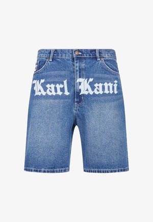 Világoskék farmer rövidnadrág klasszikus fazonban. Nagy fehér "Karl Kani" felirattal az elején, öt zsebbel és ezüst színű hardverekkel rendelkezik.