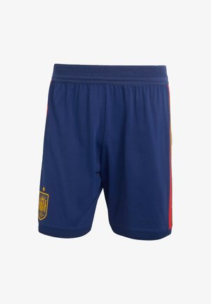 Marinblå sportshorts med resårmidja, med röda och gula sidostråkar samt en guldemblem på det nedre vänstra benet.