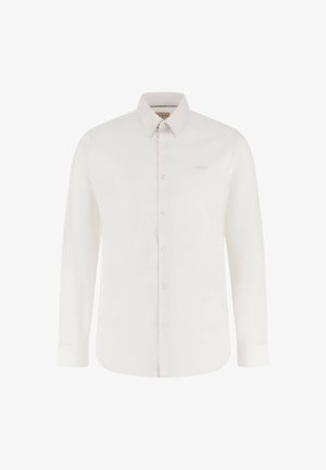 Bílá dlouhá košile s dlouhým rukávem vyrobená z hladké látky, s předním zapínáním na knoflíky, klasickým límcem a jemným logem na hrudi.
