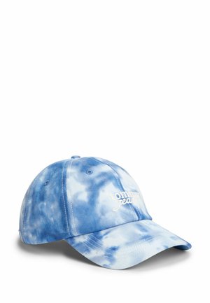 Gorra de béisbol azul y blanca con efecto tie-dye, visera curvada y logo bordado en blanco "tommy jeans" en la parte frontal.