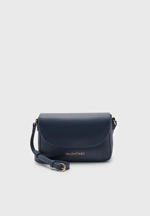 Navy blue Valentino leather crossbody bag with curved flap, gold logo, and adjustable strap with gold buckle on a plain background.