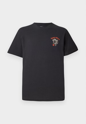 Black cotton T-shirt featuring a round neckline, short sleeves, and a graphic design of a dog’s face with red accents on the chest.