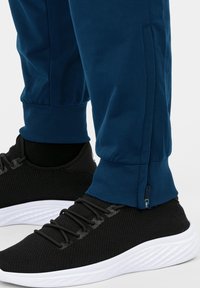 JAKO CLASSICO - Tracksuit bottoms - blauweiss