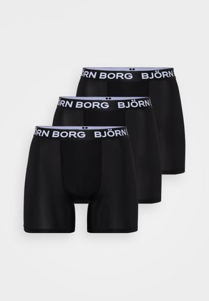 Tres pares de boxers negros con una suave cinturilla elástica que presenta el texto "BJÖRN BORG" en blanco. Tejido suave, diseño ajustado.