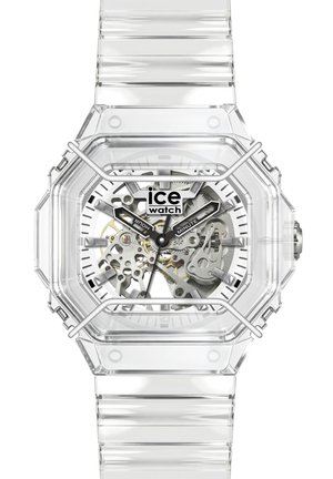 Priehľadné hodinky s viditeľnými vnútornými prevodmi, čiernymi označenými hodinovou a minútovou ručičkou a logom "ice watch" na ciferníku.