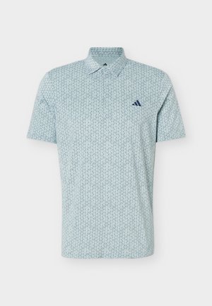 Light blue short-sleeve polo shirt with small dark geometric pattern and dark blue Adidas logo on the left chest.