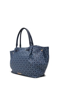 Navy blue tote bag with circular pattern, textured fabric, dual handles, and gold hardware accents. Spacious design with a structured shape.