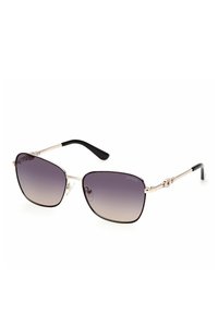 Occhiali da sole marroni e neri con lenti a gradiente, forma quadrata, montatura in metallo, steli dettagliati e logo in evidenza sulla montatura.