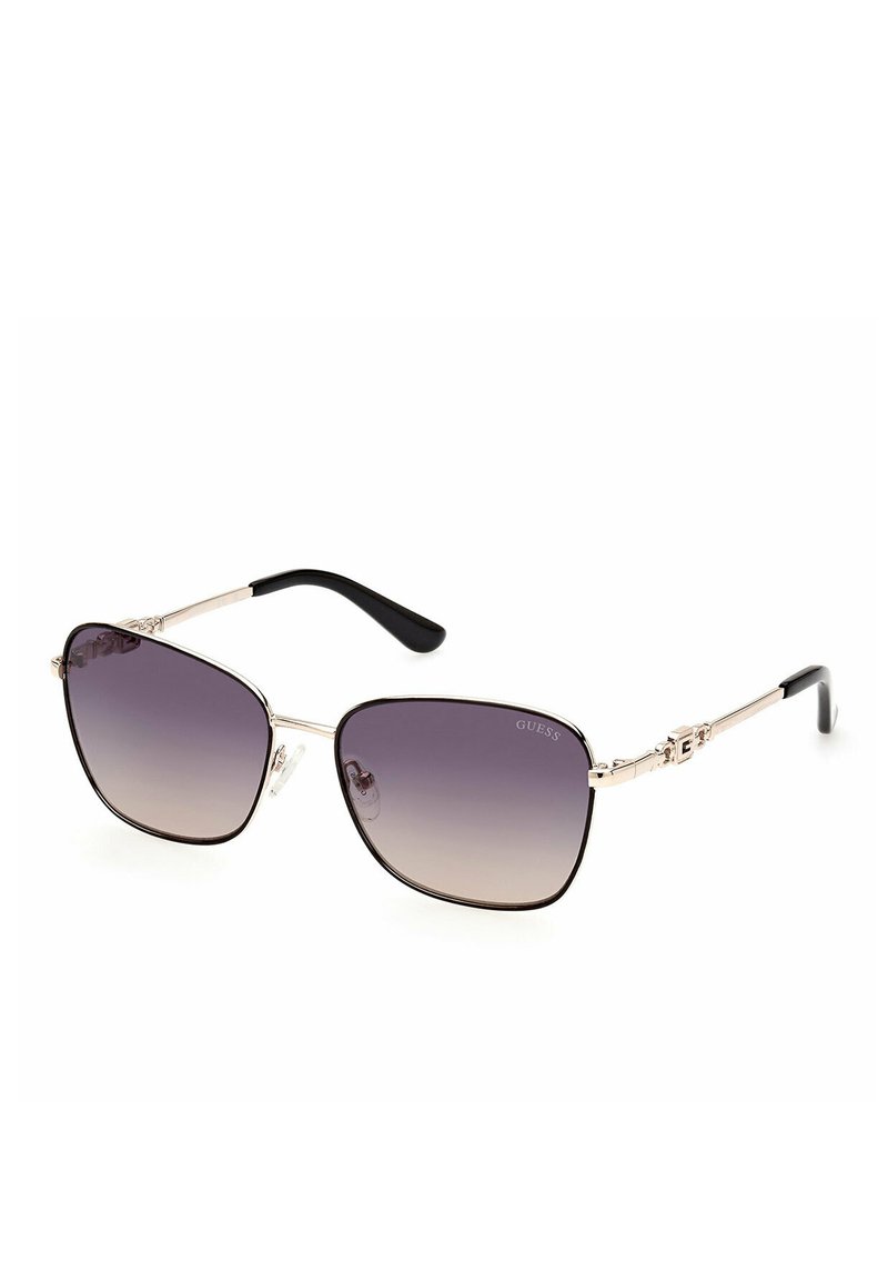 Occhiali da sole marroni e neri con lenti a gradiente, forma quadrata, montatura in metallo, steli dettagliati e logo in evidenza sulla montatura.