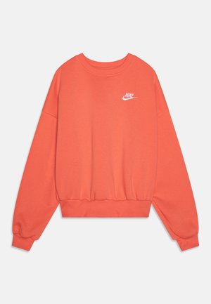Sweatshirt Nike orange avec manches longues, col rond, poignets côtelés, ceinture ajustée et un petit logo blanc sur la poitrine.