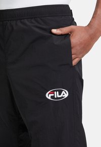 Fila LUGANO - Pantalones deportivos - black