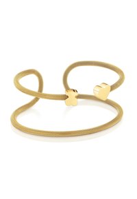 Pulsera de malla dorada con dos extremos decorativos: uno en forma de corazón y otro en forma de trébol, ambos con acabado pulido, sobre una banda flexible.