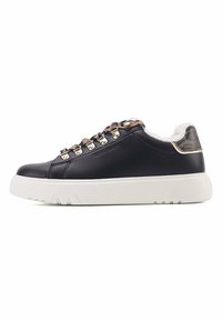 Black leather sneaker with white sole, metallic accents, and brown leopard print detail on the heel. Lace-up design with fur lining.