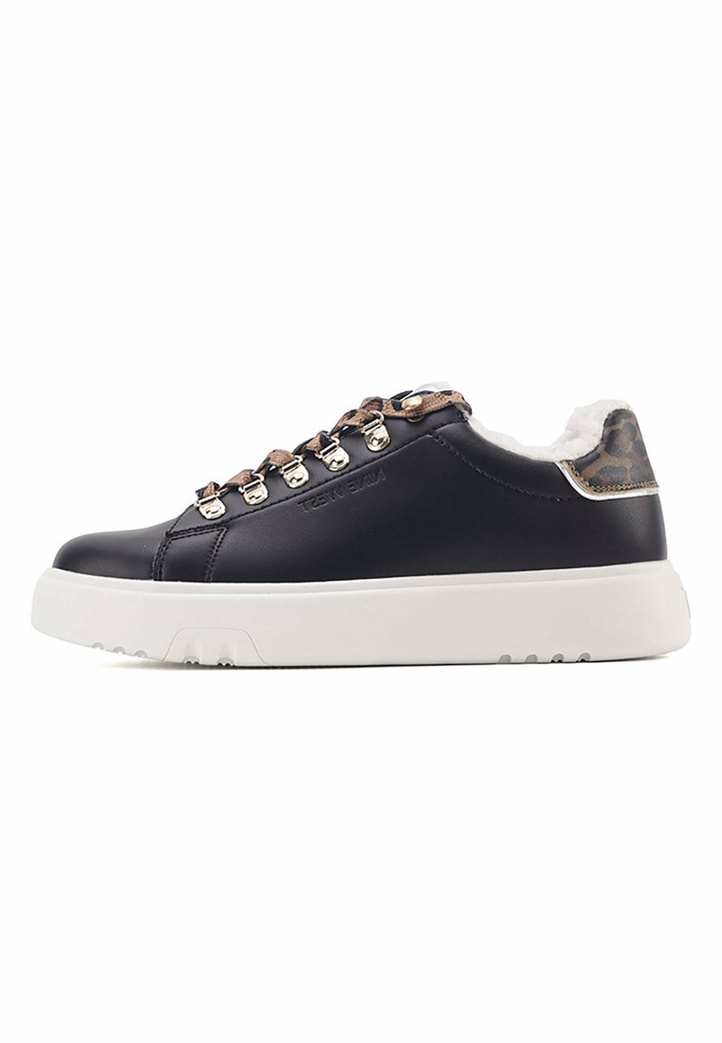 Black leather sneaker with white sole, metallic accents, and brown leopard print detail on the heel. Lace-up design with fur lining.