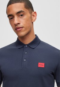HUGO DERESO - Polo shirt - dark blue
