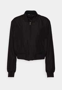 Veste bomber noire cropped avec fermeture éclair à l'avant, col, poignets et ourlet côtelés, et poches latérales discrètes.