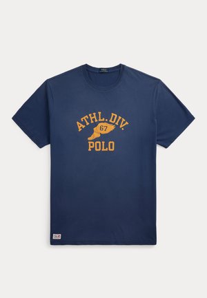 Navy blue cotton t-shirt with round neck, featuring yellow printed text: "ATHL.DIV. 67 POLO" and logo at the hem. Short sleeves, regular fit.