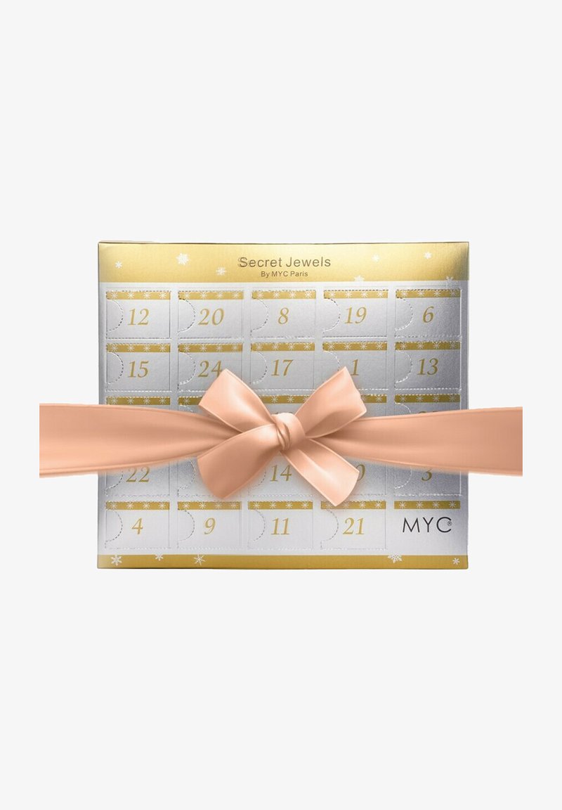 Calendario dell'avvento con foglia d'argento, decorazioni dorate e aperture numerate. Legato con un morbido fiocco di un leggero rosa chiaro per la chiusura.