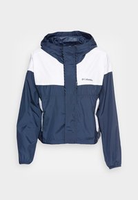 Lekka kurtka w granatowo-białym kolorze z kapturem, zapinana na przedni zamek błyskawiczny, z elastycznymi mankietami i logo na piersi.