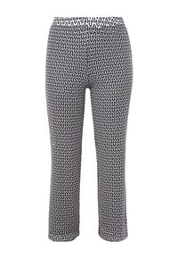 Leggings à motifs noir et blanc avec un design ondulé, taille élastique et coupe longueur cheville. Fabriqués en tissu extensible.