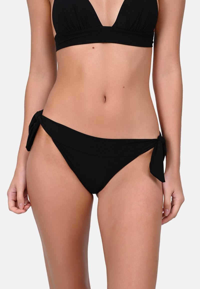 Black bikini set featuring a triangular top with gathered fabric and a bottom with adjustable ties at the hips. Smooth texture, minimalistic design.
