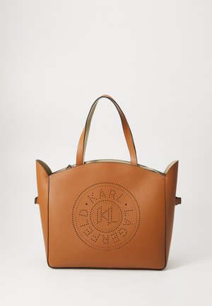 Brown leather tote bag with perforated logo detail, rounded top, and dual handles. Features a contrasting light lining and structured shape.