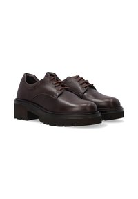 Brown leather shoes with a smooth finish, rounded toe, lace-up design, and thick rubber sole featuring a tread pattern for grip.