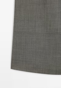 Gray woven fabric with a smooth texture, featuring a seam detail near the bottom edge and a slightly curved hemline.