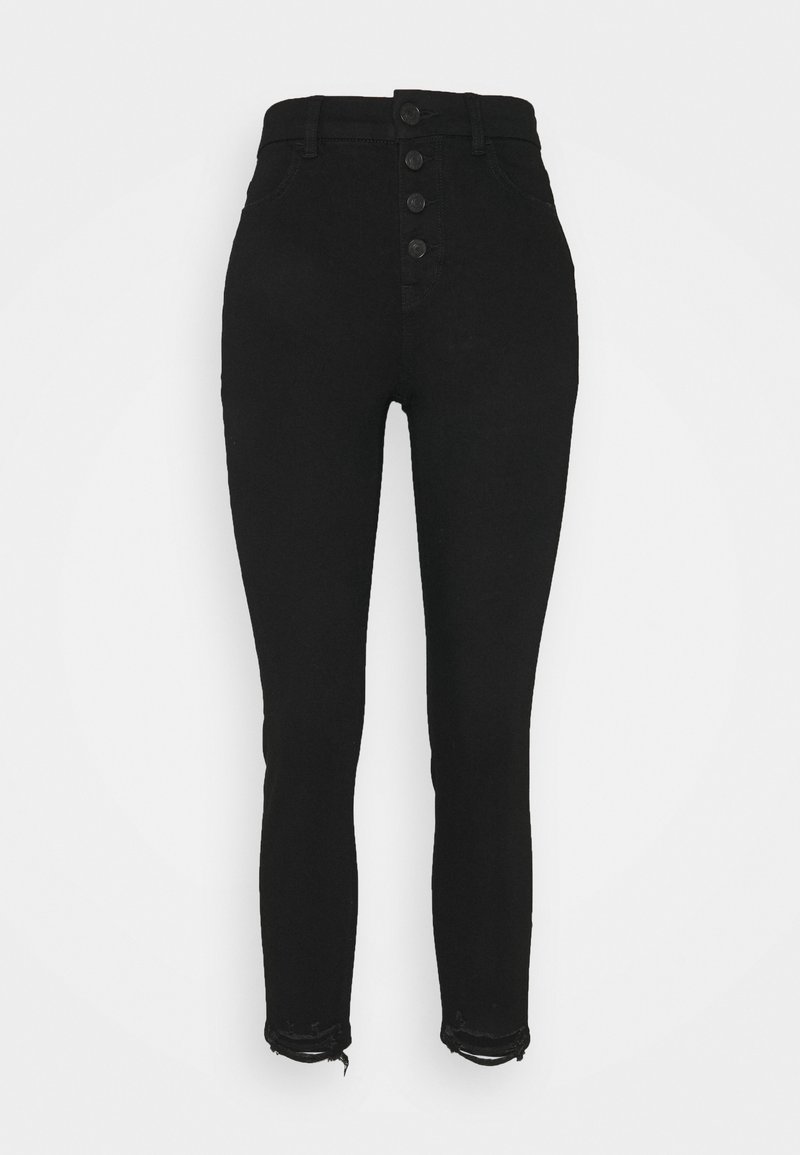 Jeans skinny noirs taille haute avec un zip à cinq boutons, présentant une texture lisse et des ourlets effilochés pour un look usé.