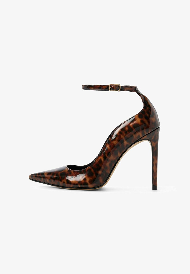 Glossy leopard-print stiletto heel with pointed toe and slim ankle strap with gold buckle on white background.