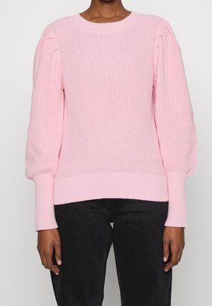 Rosa stickad tröja med rund halsringning, ribbade manschetter och ballongärmar. Har ett strukturerat, vävt mönster och en figurnära nederkant.