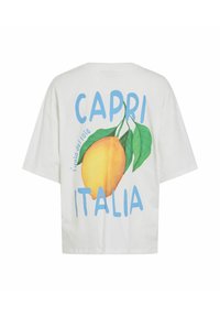 T-shirt blanc avec une grande illustration de citron et de feuilles vertes, texte bleu "CAPRI ITALIA" et texte incurvé plus petit "l'isola del sole" au dos.