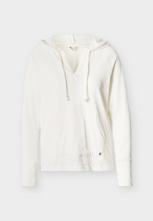 Polo à capuche blanc à manches longues avec col en V, cordons, poche kangourou et tissu légèrement texturé.