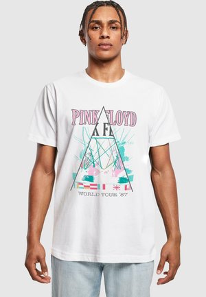 Hvid bomulds T-shirt med et Pink Floyd grafik i pink, teal og blå med trekantede designs og teksten "WORLD TOUR '87".