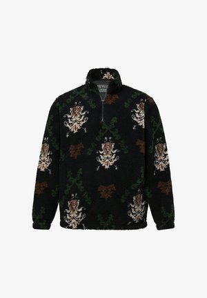 Pull en polaire noir avec col haut, orné de motifs floraux et de vignes complexes en marron, vert et crème. Fermeture demi-zippée.