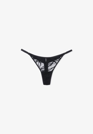 Black lace thong with sheer panels, featuring a geometric pattern and adjustable straps. Includes a small keyhole detail at the front.