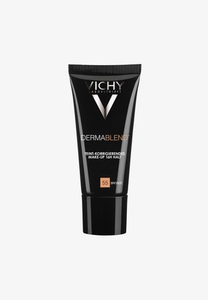 Black tube with a glossy finish, features "VICHY" logo, "DERMABLEND" text, shade "55 BRONZE," and a textured cap.